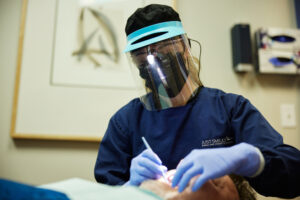 Hilliard dentist Dr. Shelley Thompson performing a full mouth reconstruction smile makeover for a Columbus patient in need.