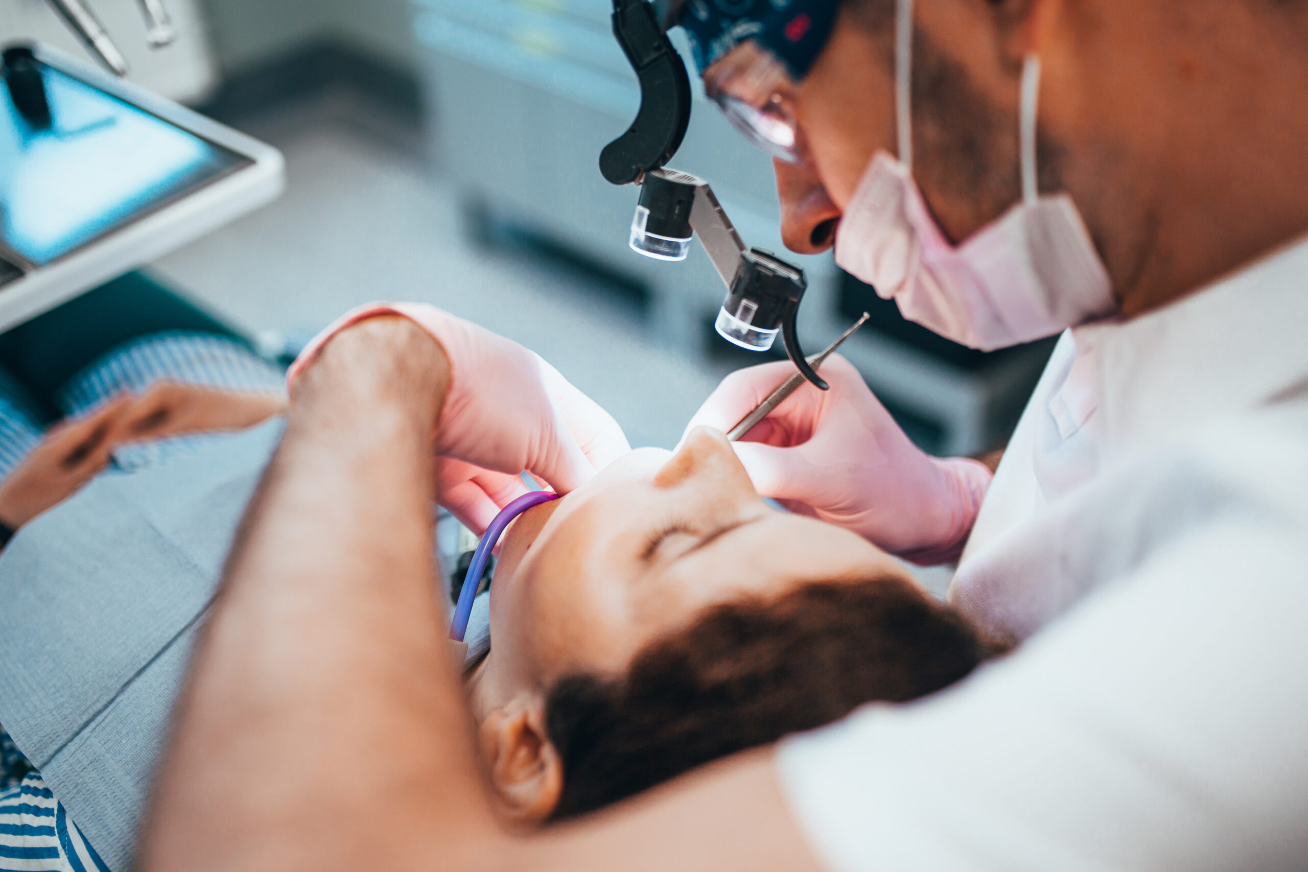 dentist performing oral surgery in Hilliard, OH